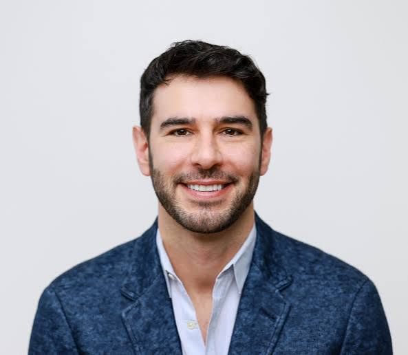 Portrait of Adam Braun, keynote speaker and entrepreneur, available for booking through Infinite Speakers.
