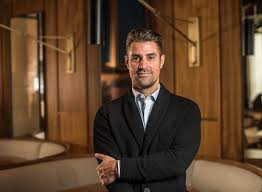 Portrait of restaurateur and keynote speaker Kevin Boehm in a restaurant setting.
