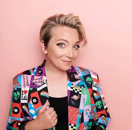 Generational workplace expert and keynote speaker Lindsay Boccardo wearing a colorful patterned blazer.