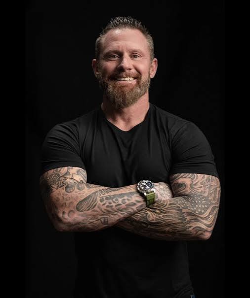 Portrait of motivational speaker and former Navy SEAL Ray Cash Care with arms crossed.