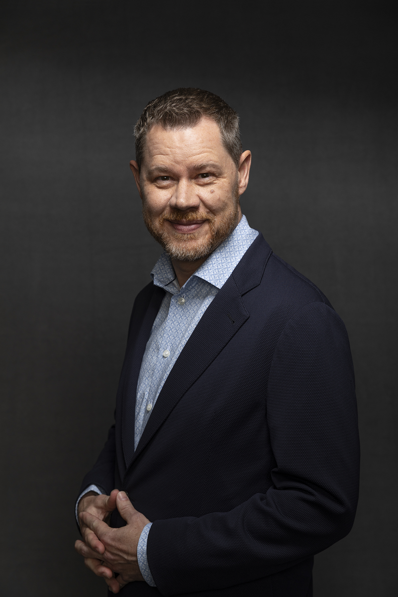Headshot of Trent Gillespie, operational AI expert and keynote speaker.