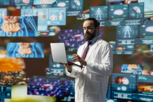 Healthcare professional using laptop amidst digital displays illustrating medical AI and technology innovation.