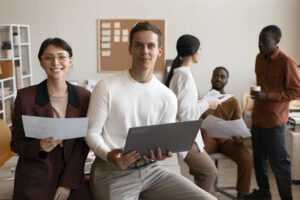 Diverse corporate team collaborating in an office representing high-performing individuals and teams.